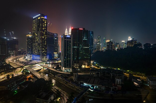 High angle view of illuminated buildings in city at night