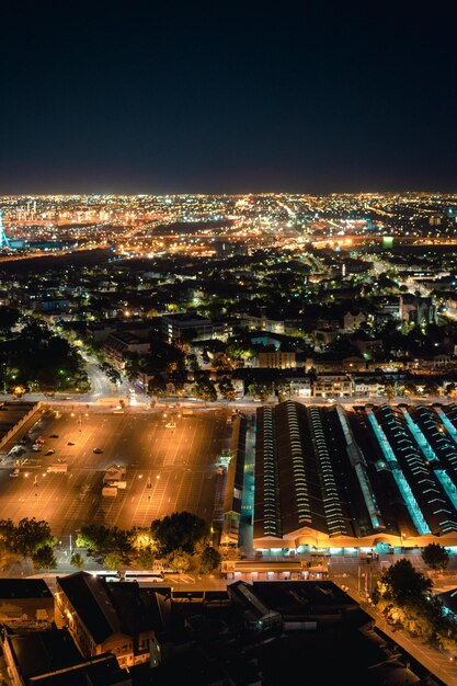 High angle view of illuminated buildings in city at night