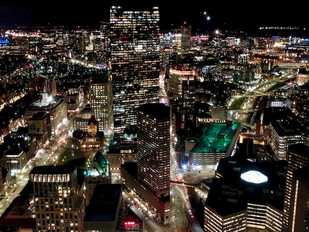 High angle view of illuminated buildings in city at night