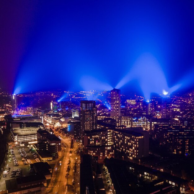 High angle view of illuminated buildings in city at night