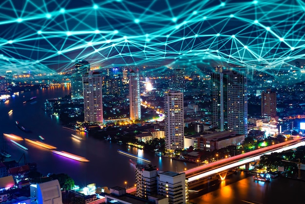 high angle view of illuminated buildings in city at night