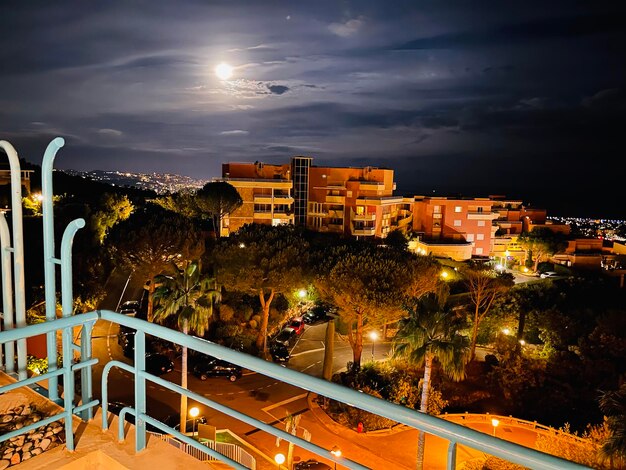 High angle view of illuminated buildings in city at night