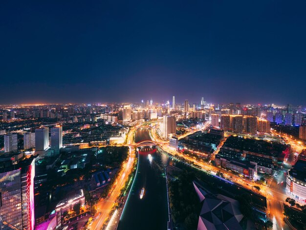 Photo high angle view of illuminated buildings in city at night