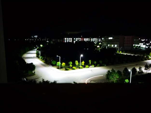 High angle view of illuminated buildings in city at night