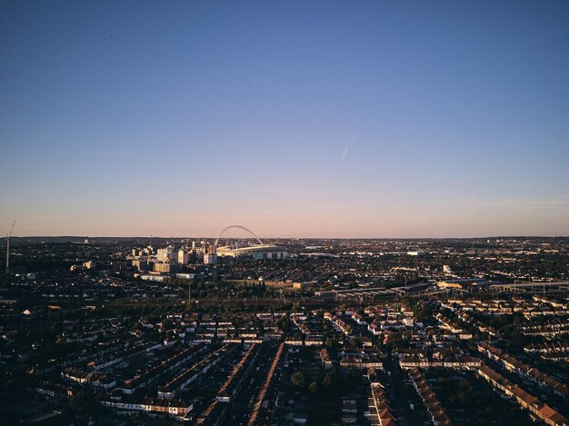 Photo high angle view of illuminated city against sky during sunset