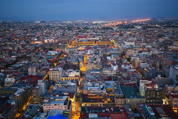 High angle view of illuminated city against sky