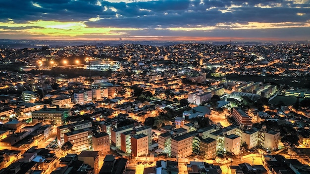 High angle view of illuminated city against sky