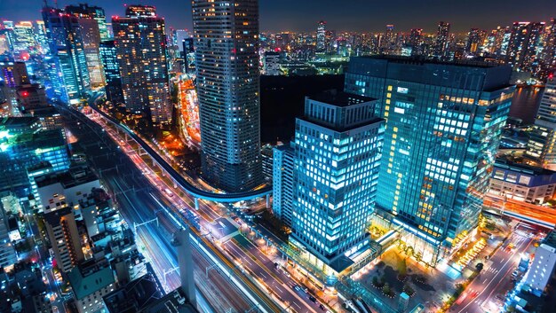 High angle view of illuminated city buildings at night