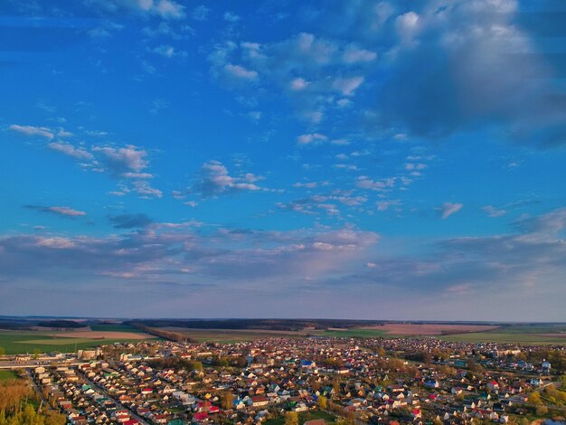 High angle view of illuminated field against blue sky