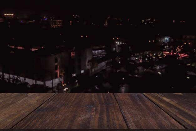 Photo high angle view of illuminated street amidst buildings in city at night