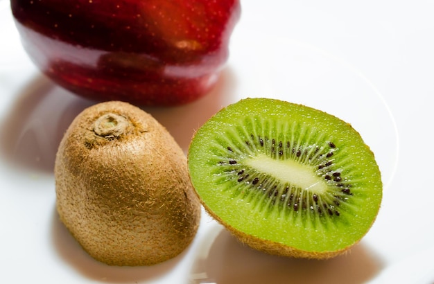 High angle view of kiwi and apple on plate