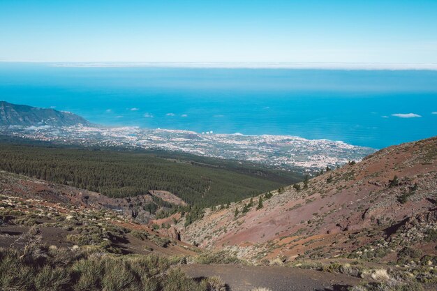 High angle view of land and sea against sky