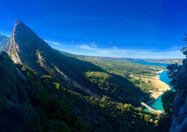 High angle view of landscape against blue sky