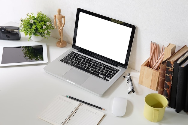 High angle view of laptop and book on table