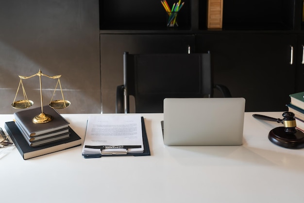 High angle view of laptop and contract on table