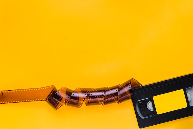 High angle view of leather bag against yellow background