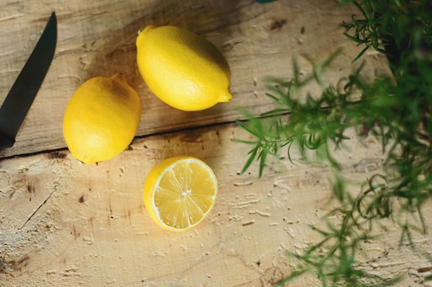 High angle view of lemon and herb on table