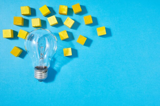 High angle view of light bulb on blue background