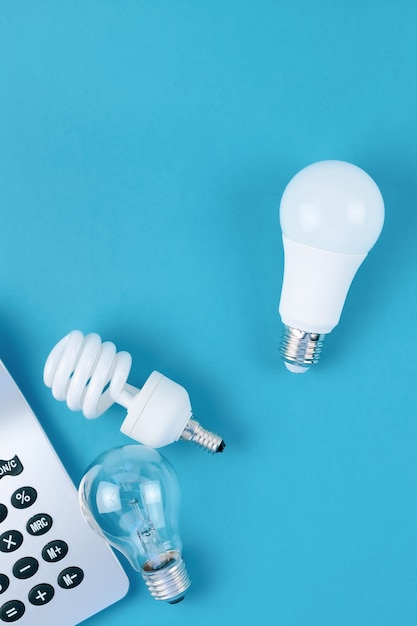 High angle view of light bulb on table against blue background