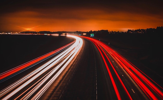 High angle view of light trails on highway at night