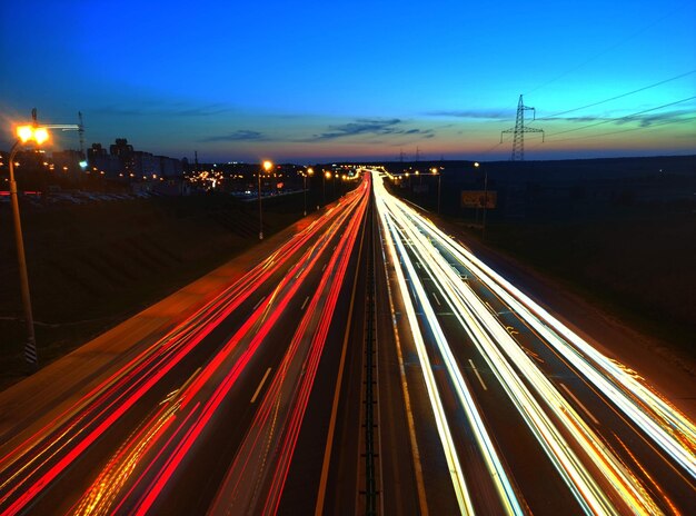 High angle view of light trails on highway at night