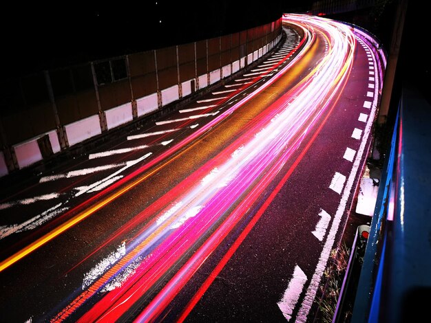 Photo high angle view of light trails on road at night