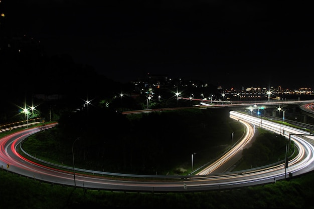 High angle view of light trails on road at night