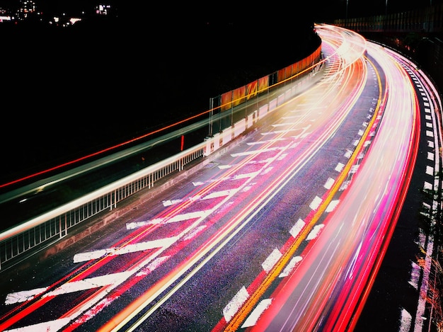 High angle view of light trails on road at night