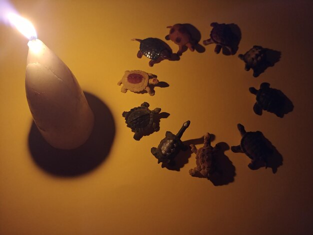 High angle view of lit candles on table