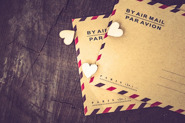 High angle view of mail envelopes on wood