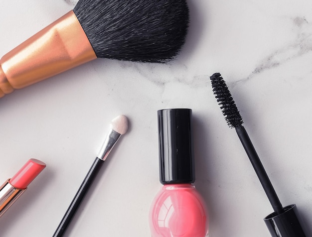 High angle view of make-up brushes against white background