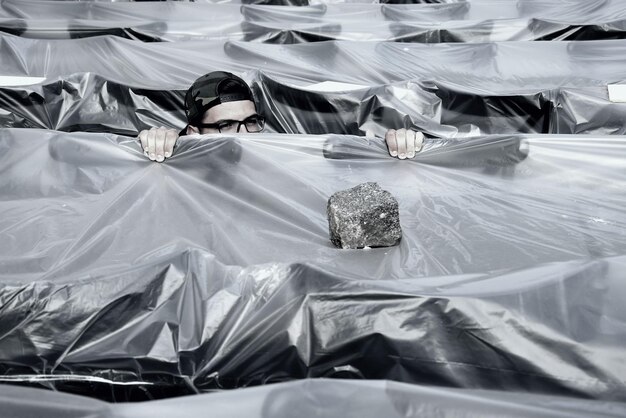 Photo high angle view of man amidst plastic