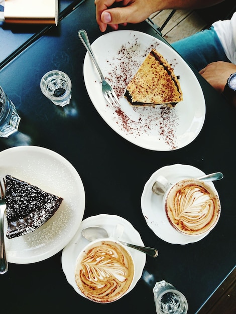 High angle view of man having breakfast on table