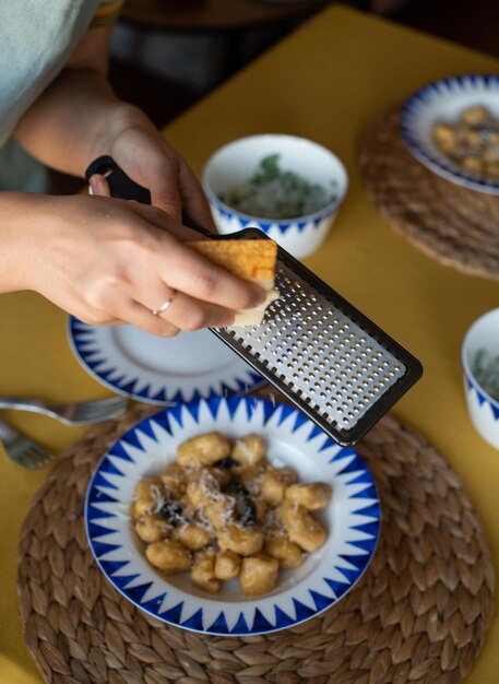 High angle view of man holding food on table