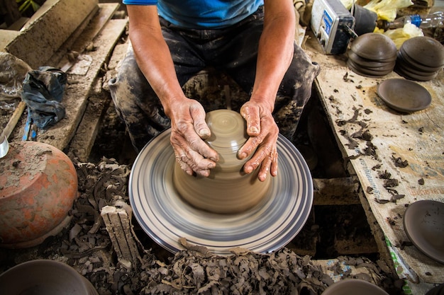 high angle view of man molding at workshop