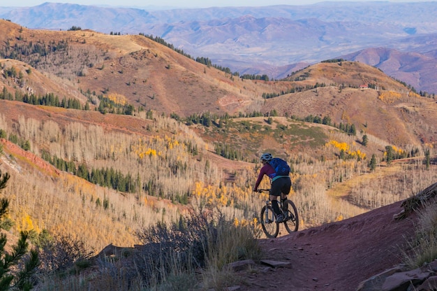 High angle view of man riding bicycle on mountain