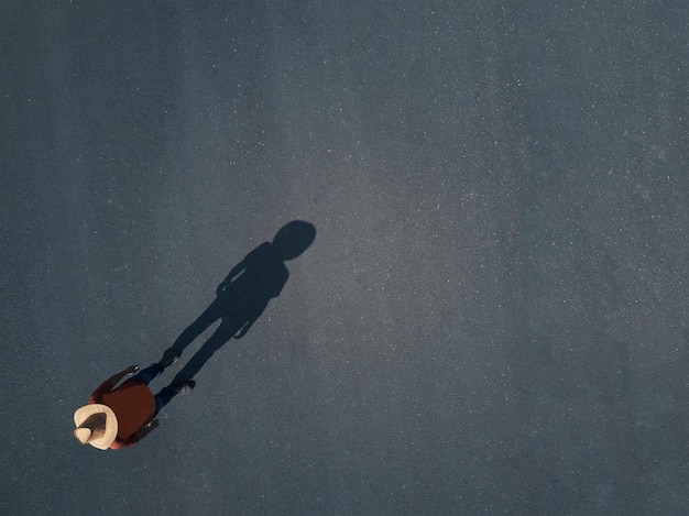 high angle view of man standing on road