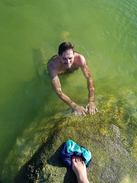 High angle view of man swimming in lake