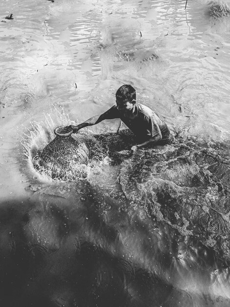 High angle view of man swimming in sea