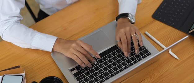 High angle view of man using laptop on table