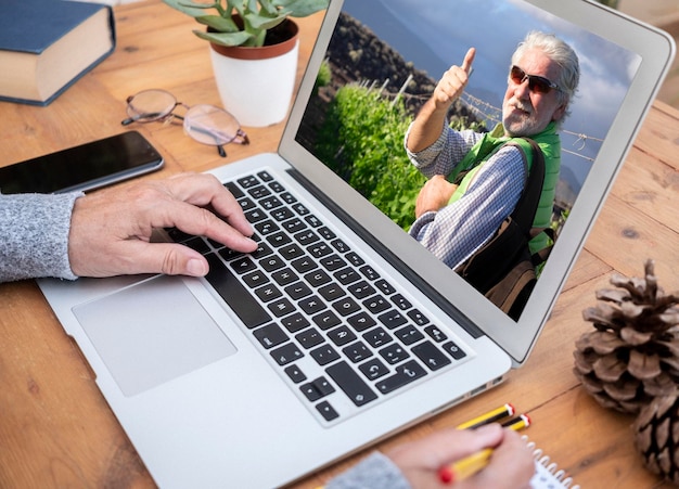 High angle view of man using laptop on table