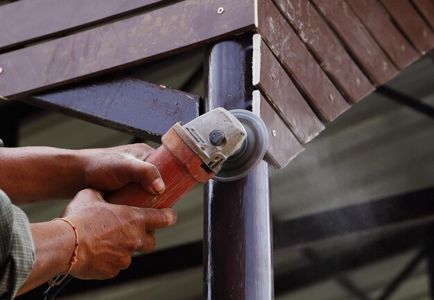 High angle view of man working on metal