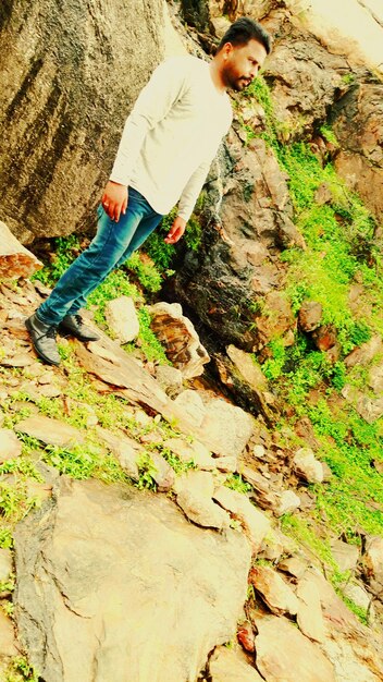 High angle view of man working on rock