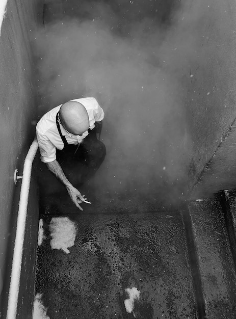 High angle view of man working in water