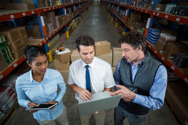 High angle view of managers are looking a laptop