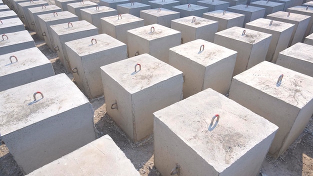 High angle view of many Underwater Concrete Anchors mooring buoy blocks in industrial Yard area