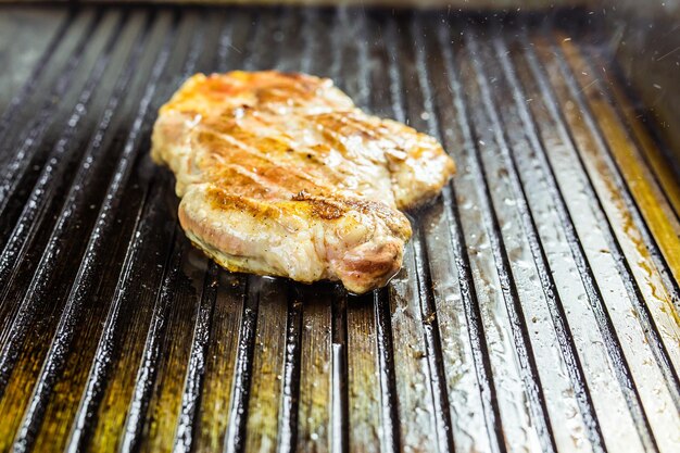 High angle view of meat on barbecue grill