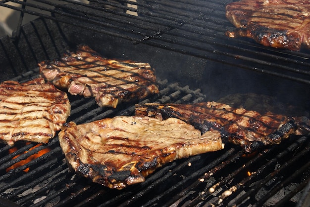 High angle view of meat on barbecue grill