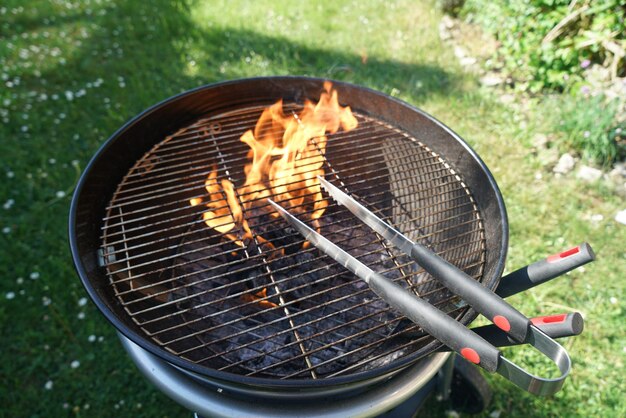 High angle view of meat on barbecue grill