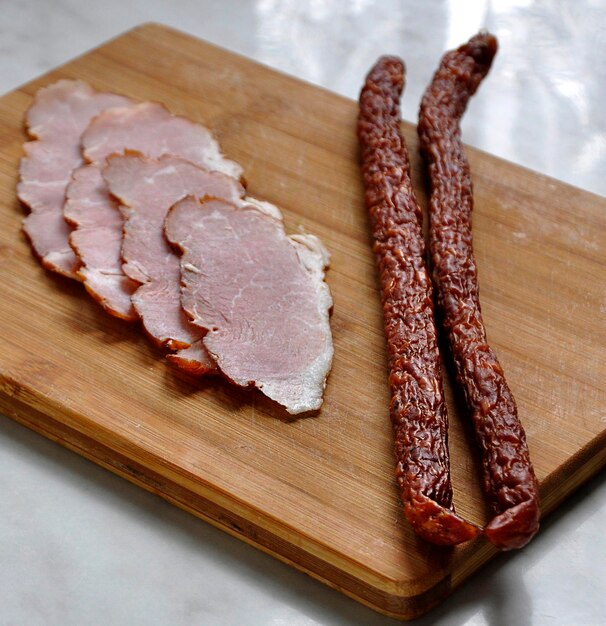 High angle view of meat on cutting board